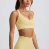 Sutien sport fără cusături Super Sculpt cu bretele încrucișate pe spate, în culoarea galben unt Sutien sport fără cusături Super Sculpt cu bretele încrucișate pe spate, în culoarea galben unt