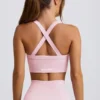 Sutien sport fără cusături Super Sculpt cu bretele încrucișate pe spate, în culoarea roz pudră Sutien sport fără cusături Super Sculpt cu bretele încrucișate pe spate, în culoarea roz pudră