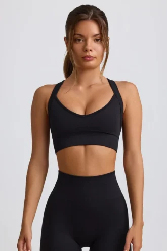 Sutien sport fără cusături Super Sculpt cu bretele încrucișate pe spate, negru