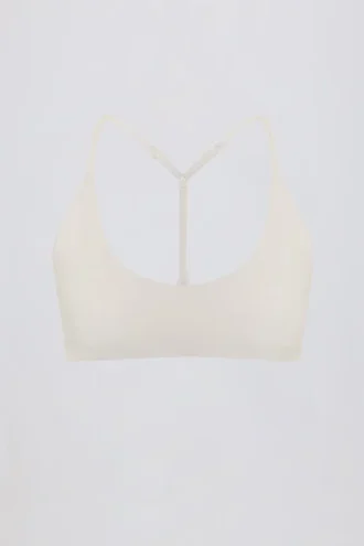 Sutien sport Soft Active cu bretele încrucișate la spate, culoare crem