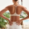 Sutien sport Soft Active cu bretele încrucișate la spate, culoare crem