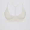 Sutien sport Soft Active cu bretele încrucișate la spate, culoare crem