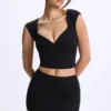 Top Cora din modal cu mâneci scurte și volane, negru Top Cora din modal cu mâneci scurte și volane, negru