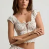 Top corset din poplin de bumbac cu volane Faela, cu imprimeu de trandafiri