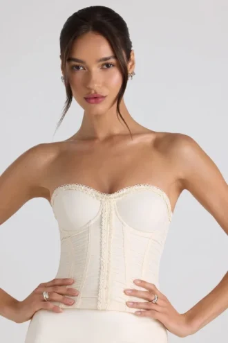 Top corset fără bretele, cu dantelă și volane, Melvina, în culoarea ivoriu Top corset fără bretele, cu dantelă și volane, Melvina, în culoarea ivoriu