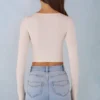 Top cu bretele din modal cu nervuri și mâneci lungi Margaux, de culoare ivoriu Top cu bretele din modal cu nervuri și mâneci lungi Margaux, de culoare ivoriu