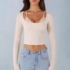 Top cu bretele din modal cu nervuri și mâneci lungi Margaux, de culoare ivoriu Top cu bretele din modal cu nervuri și mâneci lungi Margaux, de culoare ivoriu