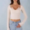 Top cu bretele din modal cu nervuri și mâneci lungi Margaux, de culoare ivoriu Top cu bretele din modal cu nervuri și mâneci lungi Margaux, de culoare ivoriu