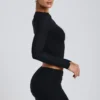 Top cu mâneci lungi și volane Alia din modal, negru Top cu mâneci lungi și volane Alia din modal, negru