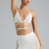 Top de bikini Liberty cu bretele încrucișate și ornamente, în culoarea Ivory Top de bikini Liberty cu bretele încrucișate și ornamente, în culoarea Ivory