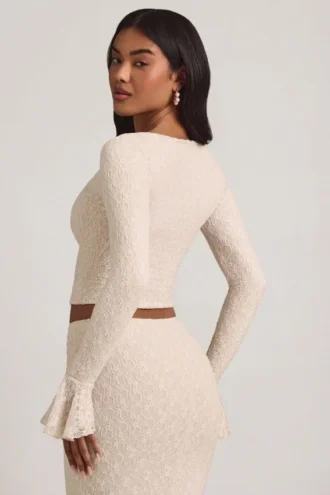 Top din dantelă cu mâneci lungi și volane Dagny, culoare ivoriu Top din dantelă cu mâneci lungi și volane Dagny, culoare ivoriu