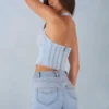 Top în stil corset Lotta cu gât halter din denim deschis Top în stil corset Lotta cu gât halter din denim deschis