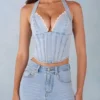 Top în stil corset Lotta cu gât halter din denim deschis Top în stil corset Lotta cu gât halter din denim deschis