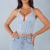 Top în stil corset Lotta cu gât halter din denim deschis Top în stil corset Lotta cu gât halter din denim deschis