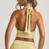 Top scurt cu gât halter Gianna din țesătură bouclé, în culoarea galben Top scurt cu gât halter Gianna din țesătură bouclé, în culoarea galben