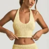 Top scurt cu gât halter Gianna din țesătură bouclé, în culoarea galben Top scurt cu gât halter Gianna din țesătură bouclé, în culoarea galben