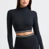 Top scurt cu guler înalt și mâneci lungi, fără spate, negru