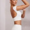 Top scurt cu mâneci scurte și spate decupat Juno, în culoarea alb Top scurt cu mâneci scurte și spate decupat Juno, în culoarea alb