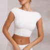 Top scurt cu mâneci scurte și spate decupat Juno, în culoarea alb Top scurt cu mâneci scurte și spate decupat Juno, în culoarea alb