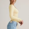 Topuri cu mâneci lungi și volane Emry Modal, în culoarea galben crem