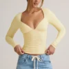 Topuri cu mâneci lungi și volane Emry Modal, în culoarea galben crem