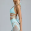Topuri de bikini Liberty cu bretele încrucișate și ornamente, în culoarea albastru gheață Topuri de bikini Liberty cu bretele încrucișate și ornamente, în culoarea albastru gheață