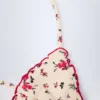 Topuri de bikini Noia Micro Triangle cu imprimeu floral roșu Topuri de bikini Noia Micro Triangle cu imprimeu floral roșu