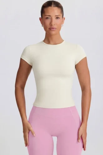 Tricou lung cu decupaje, culoare crem