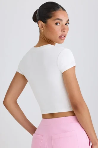Tricou scurt din jersey de bumbac elastic cu imprimeu grafic, în alb
