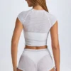 Tricou scurt, transparent, cu volane, model Santana, în culoarea alb
