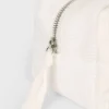 Trusă de machiaj din velur cu fundă, de culoare ivoriu Trusă de machiaj din velur cu fundă, de culoare ivoriu
